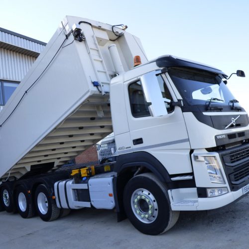 Volvo FM410 8x4 Tridem Bulk Tipper Side View with Trailer Raised