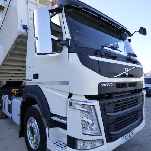 Volvo FM410 8x4 Tridem Bulk Tipper Side View with Trailer Raised